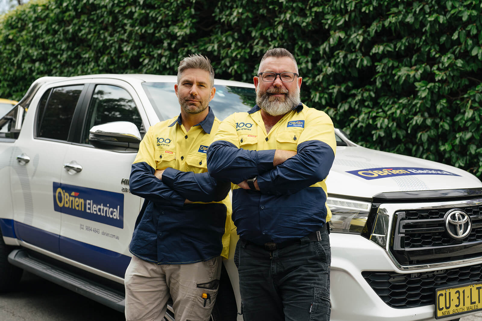 Obrien plumbing wyong team standing next to truck