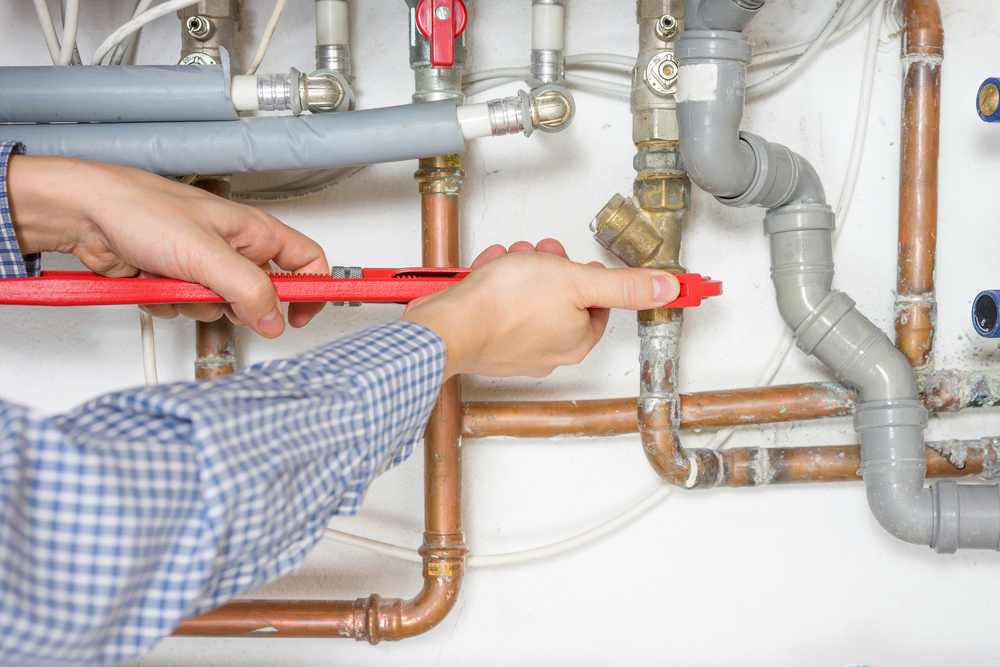 Gas Fitter Fixing Central Heating System