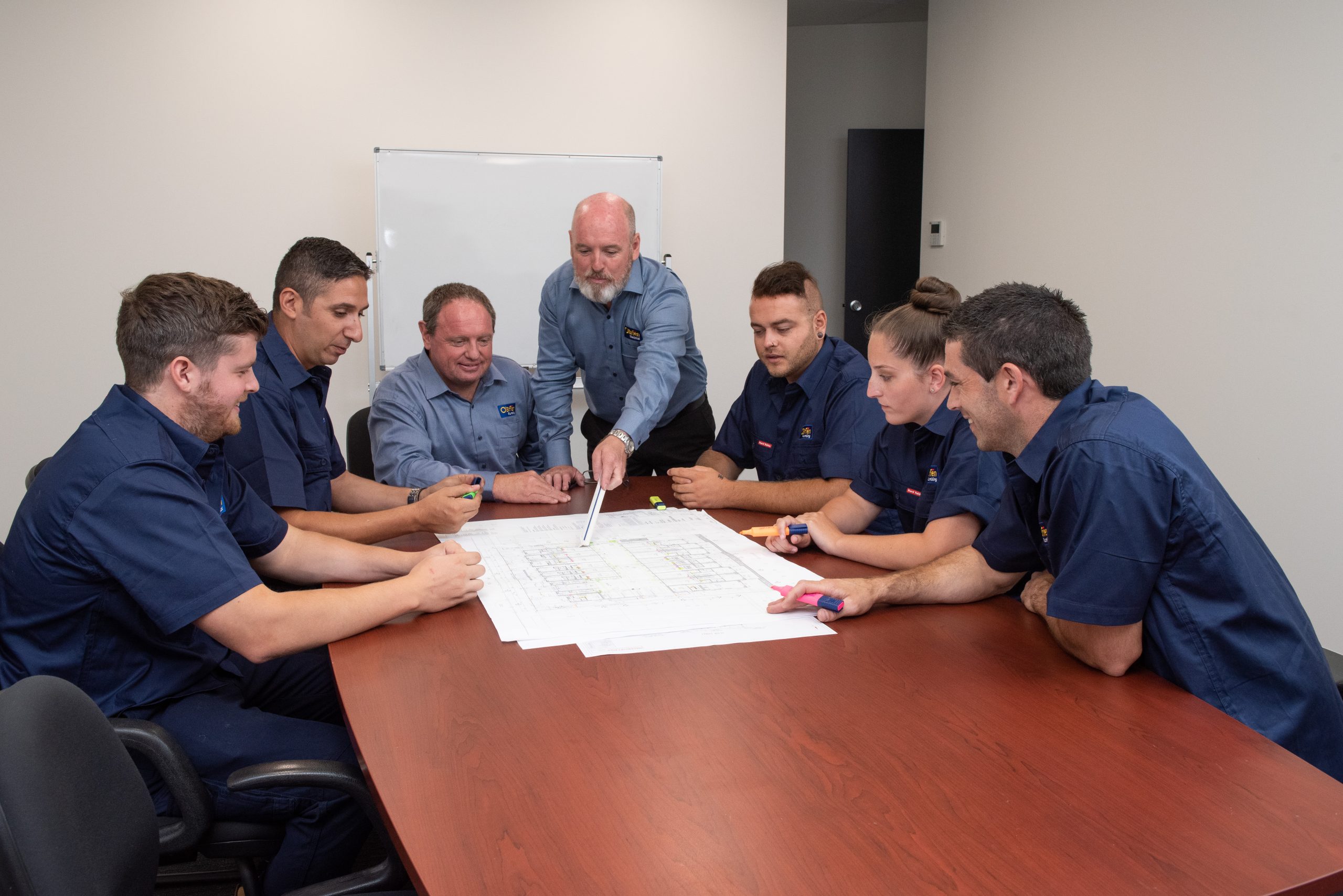 Men discussing plumbing plan